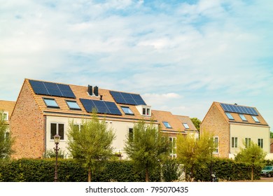 Row of new Dutch houses with solar panels in Amsterdam