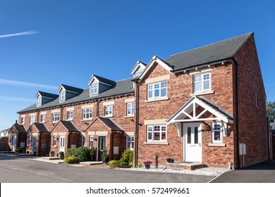Row of new terraced houses - Shutterstock ID 572499661