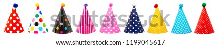 Row of nine colorful festive birthday party hats with different patterns and pom-poms