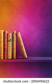 Row Of Old Books On Rainbow Shelf. Vertical Background Scene