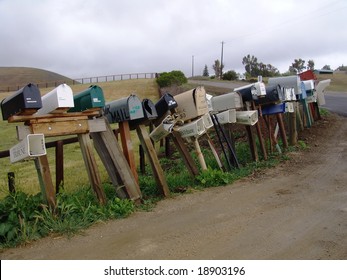 Row of old mail boxes on countryside road