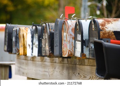 A Row Of Old Rusty Mailboxes