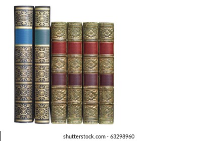 row of ornamented vintage books, isolated on white background