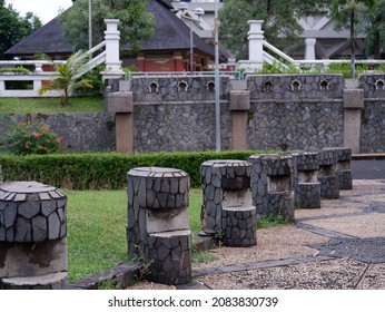 Row Of Park Benches Made Of Cement And Natural Stone