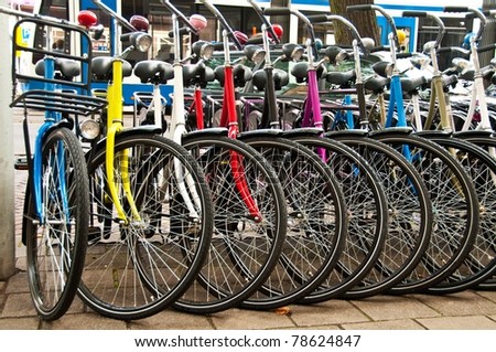Row of parked colorful bicycles