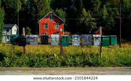 Row of post boxes in a rural area in Norway
