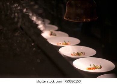 row of preparing food in professinal kitchen