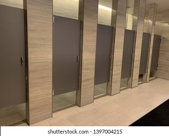 Row Of Public Modern Bathroom Stalls.