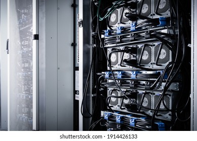 A row of racks with data storage hardware inside server room