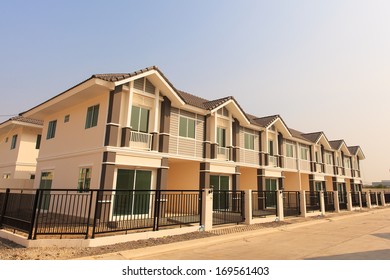 A row of ready to sell new townhouses  - Shutterstock ID 169561403