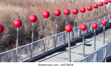 Row Of Red Balls At Contemporary Light Rail Station In Denver, Colorado.