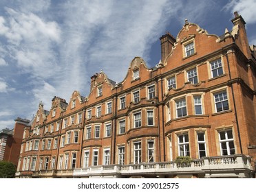 Row of red brick apartments in Mayfair, London, UK