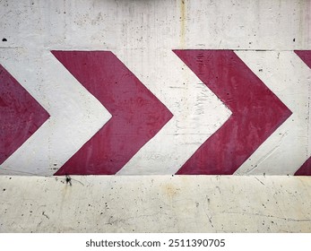 Row of red direction arrow stripes painted on concrete wall, warning arrow road sign pointing turn right, wide banner background - Powered by Shutterstock