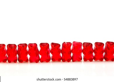 Row Of Red Gummy Bears  On A White Background