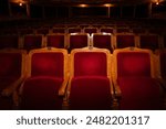 Row of red seats in theatre for design purpose