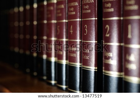 Row of reference books on library shelf