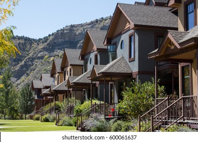Row of repeating condominiums with a mountain behind in Colorado