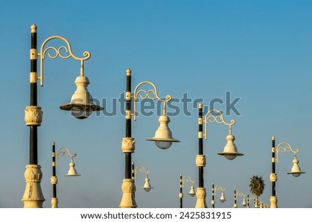 Row of retro lamp posts, street lights on the bank of the Nile river in Luxor, Egypt