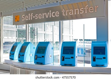 A Row Of Self Service Check In Machines In An Airport