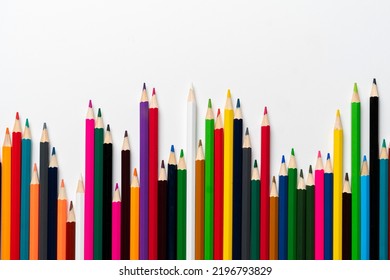 Row Of Set Of Colored Pencils Flat Lay On Pastel Background