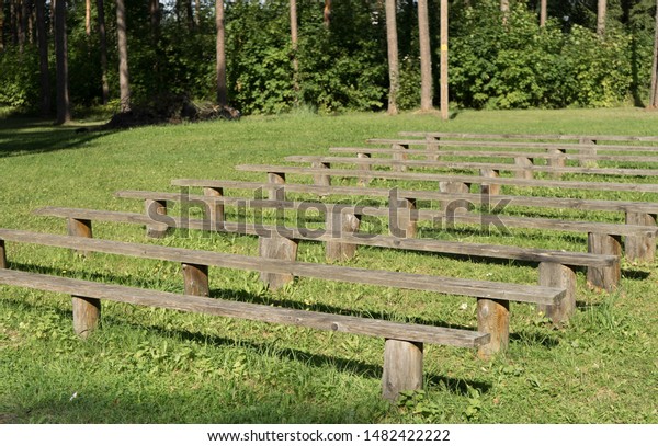 Row Simple Wooden Benches Park Front Stock Photo Edit Now 1482422222