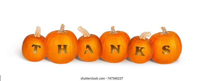 Row of six Thanksgiving holiday pumpkins carved to say Thanks and illuminated inside with candles. Isolated on white and sized for a popular social media cover image.