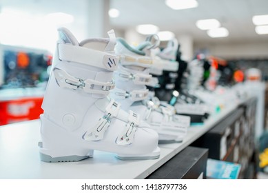 Row Of Ski And Snowboarding Boots In Sports Shop