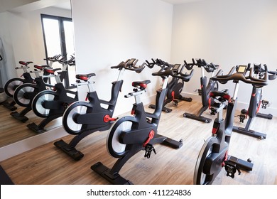 Row Of Spinning Bikes In Gym