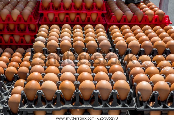 The row or the stack of eggs at the pick\
up back during transportation at the\
market.