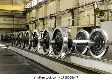 Row of steel wagon train wheels in a repair depot. Wheels of train in service.