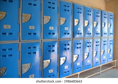 Row Of Students Lockers In Empty High School Hallway.