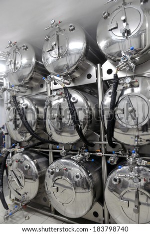 Row of tanks in microbrewery