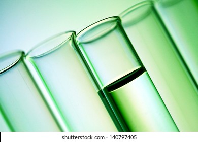 Row Of Test Tubes In Green Tone.