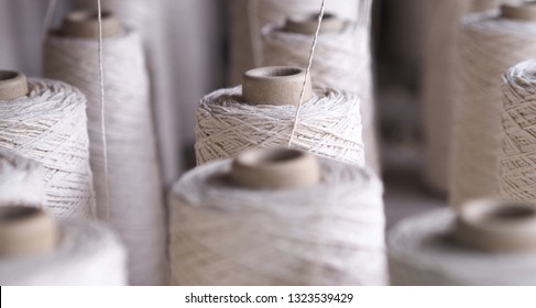 Row of textile threads industry .
