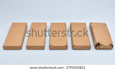 A row of thin rectangular cardboard boxes showing a sequential progression of physical damage to the corner, illustrating shipping impact and package quality lifecycle