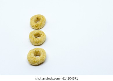 Row Of Three Cheerios On White Background