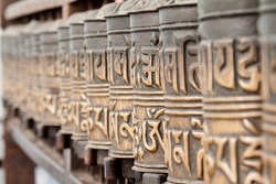A Row Of Tibetan Prayer Wheels