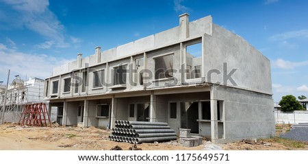 Row of Townhouse prefabricated building isolated on blue sky background.