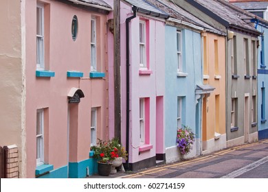 Row Of Traditional Colourful Seaside Cottages In A Fishing Village In Devon UK