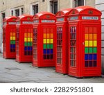 A row of traditional red Telephone Boxes, on Broad Court in the West End of London, UK.