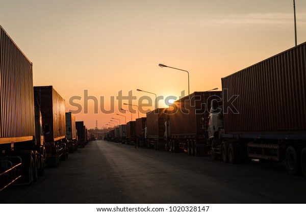 row\
of trailer park wait on two side of road in the evening at the\
economic trade zone Mae Sot district, Tak,\
Thailand