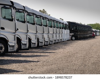 A Row Of Trucks Parked Up At The Hockenheimring.