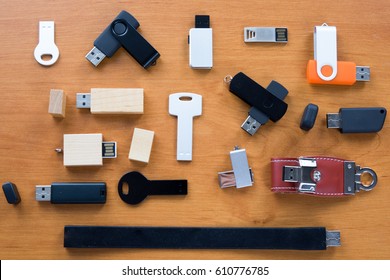 Row Of USB Flash Drives On Wooden Background