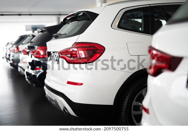 \
Row of vehicles in a dealership, cars,\
automotive industry