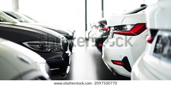 \
Row of vehicles in a dealership, cars,\
automotive industry