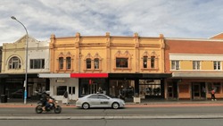 Row Of Victorian Commercial Terraces Joined At Left By The Art Deco Building Of The Unicorn Hotel Made Of Red Brick In The P O Style Of The 1930s On Oxford St.-Paddington Suburb. Sydney-NSW-Australia.