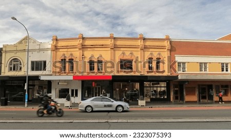 Row of Victorian commercial terraces joined at left by the Art Deco building of the Unicorn Hotel made of red brick in the P O style of the 1930s on Oxford St.-Paddington suburb. Sydney-NSW-Australia.