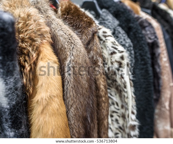 A row of vintage\
coats made of animal fur