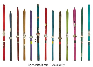 Row of vintage weathered colorful skis isolated on a white background - Shutterstock ID 2200883619