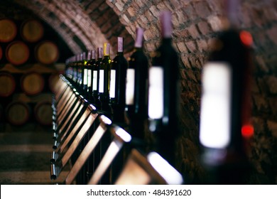 Row Of Vintage Wine Bottles In A Wine Cellar 